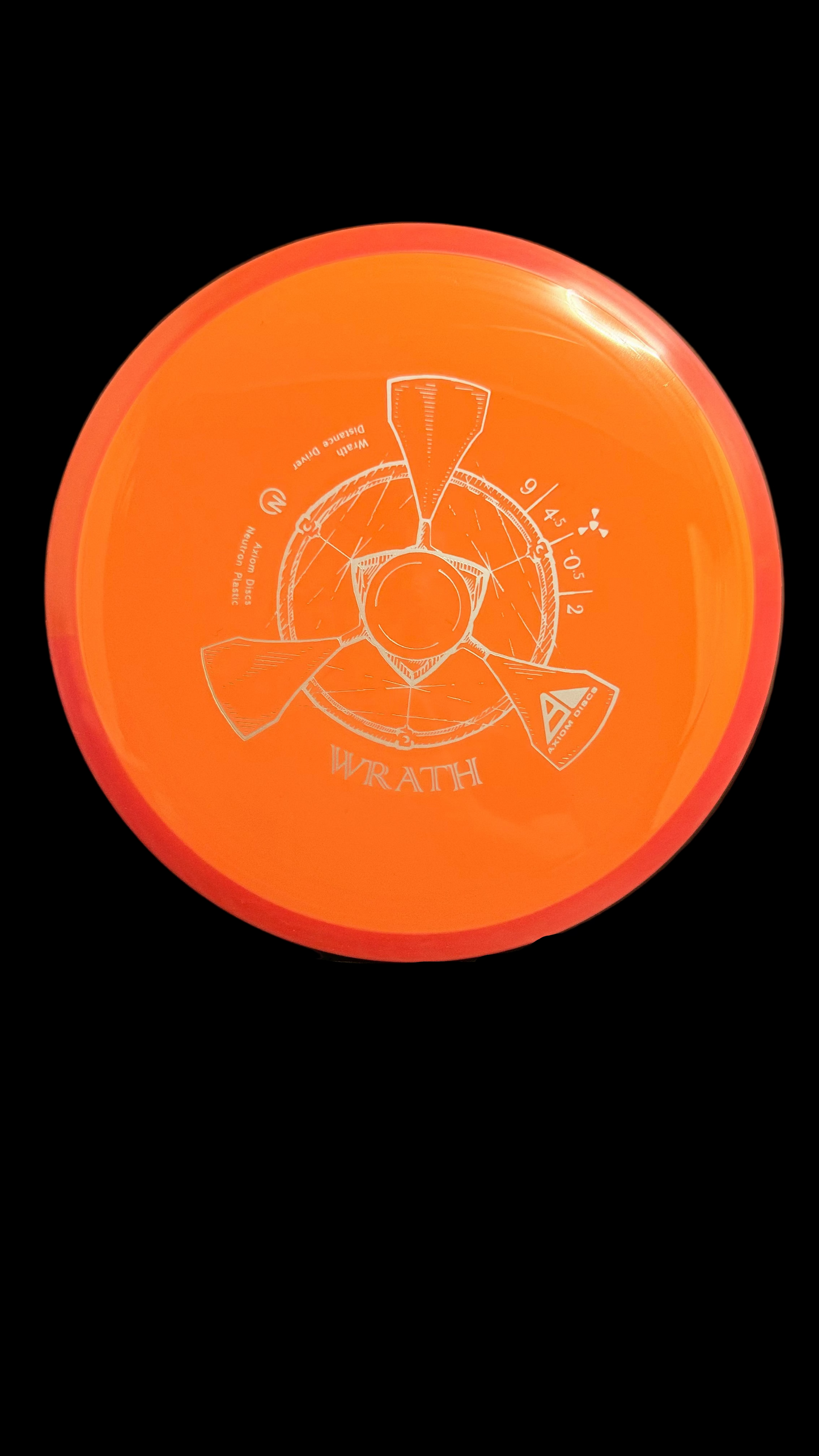 Axiom Neutron Wrath orange distance driver with red rim and white stamp on a display stand