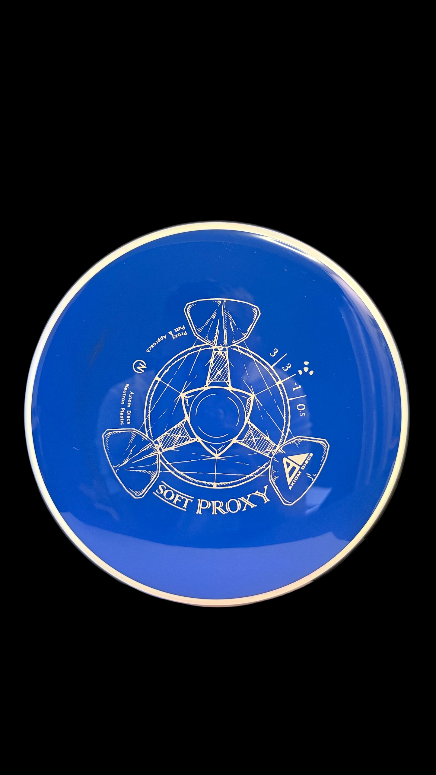 Blue Axiom Soft Proxy disc golf putter with a white rim and white line-art stamp displayed on a white surface.