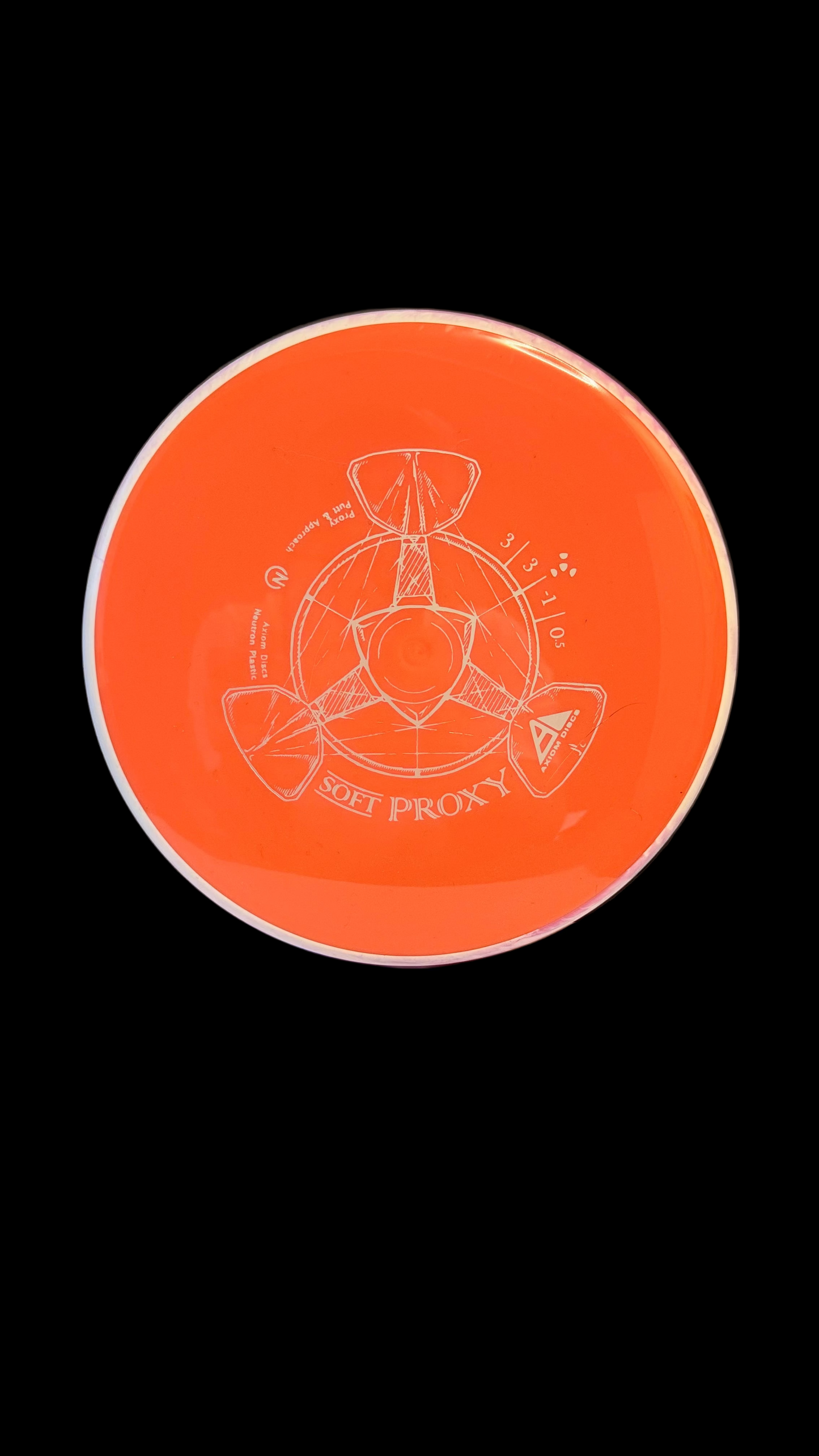 Orange Axiom Soft Proxy disc golf putter with a white rim and white line-art stamp displayed on a white surface.