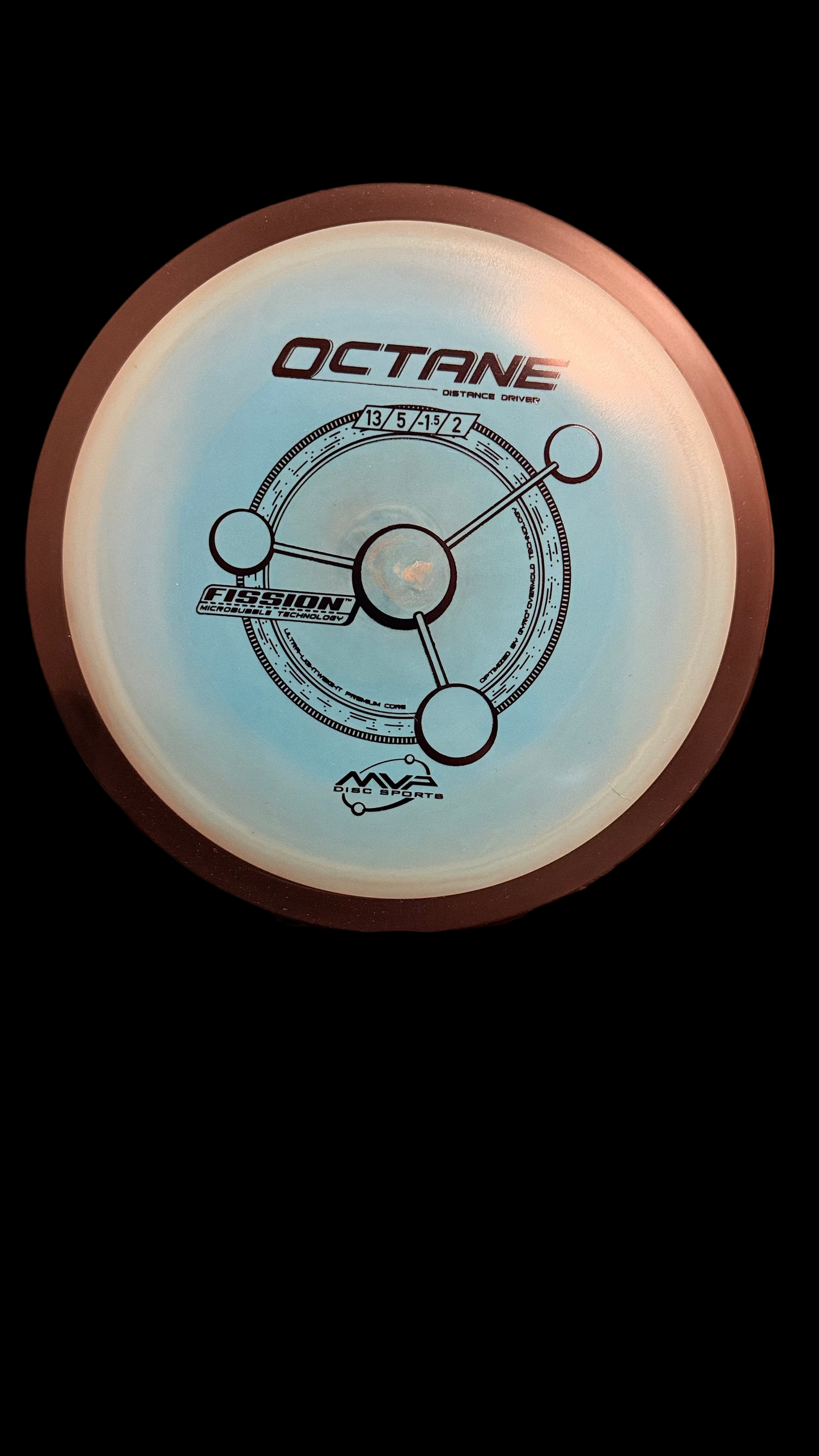 MVP Fission Octane distance driver in light blue with dark brown rim, featuring the Octane flight chart and Fission technology stamp (13 | 5 | -1.5 | 2), displayed upright on a Zens stand