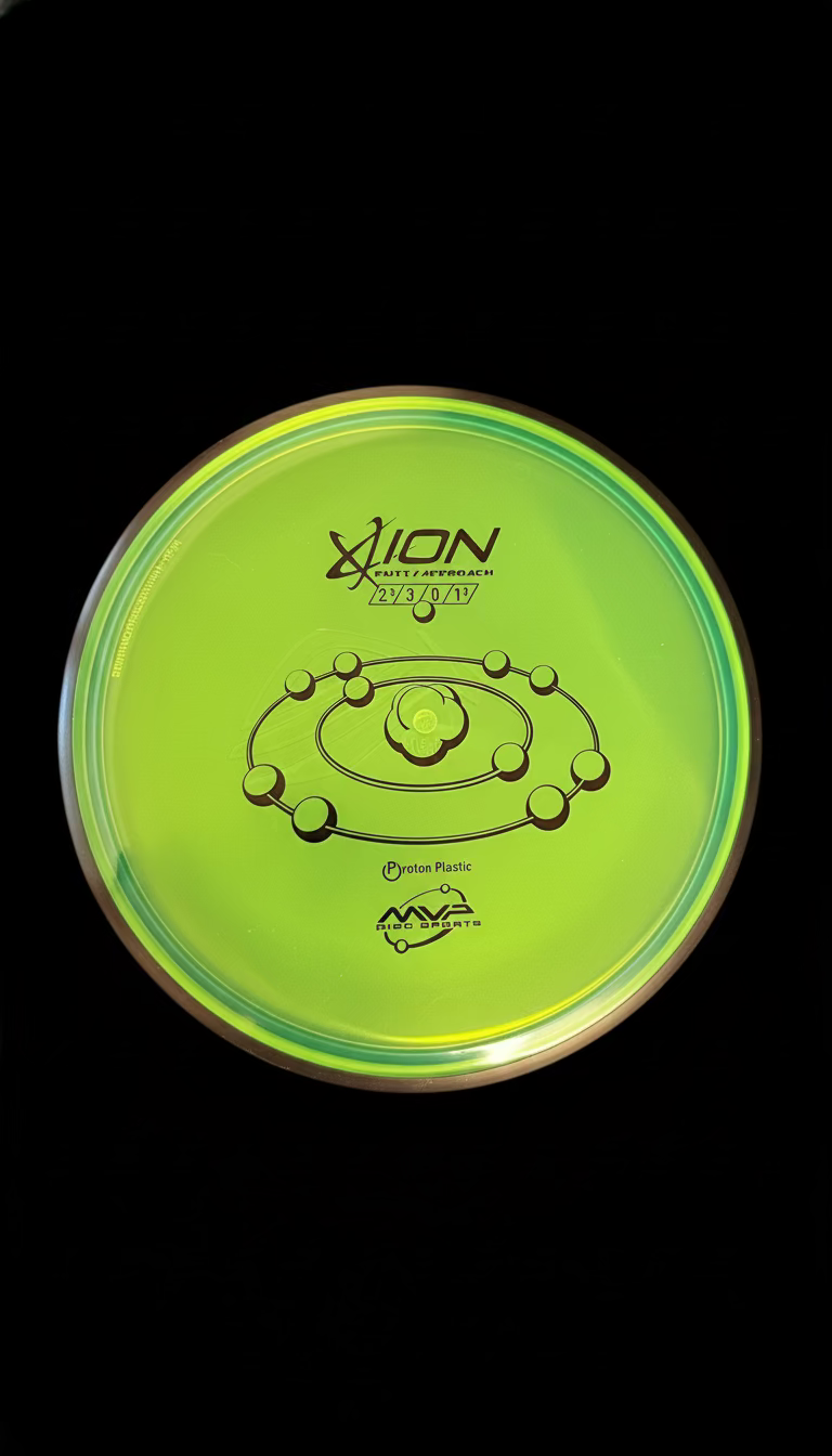 Neon yellow-green MVP Proton Ion putt and approach disc with a clear rim and black orbital-style graphic stamp.