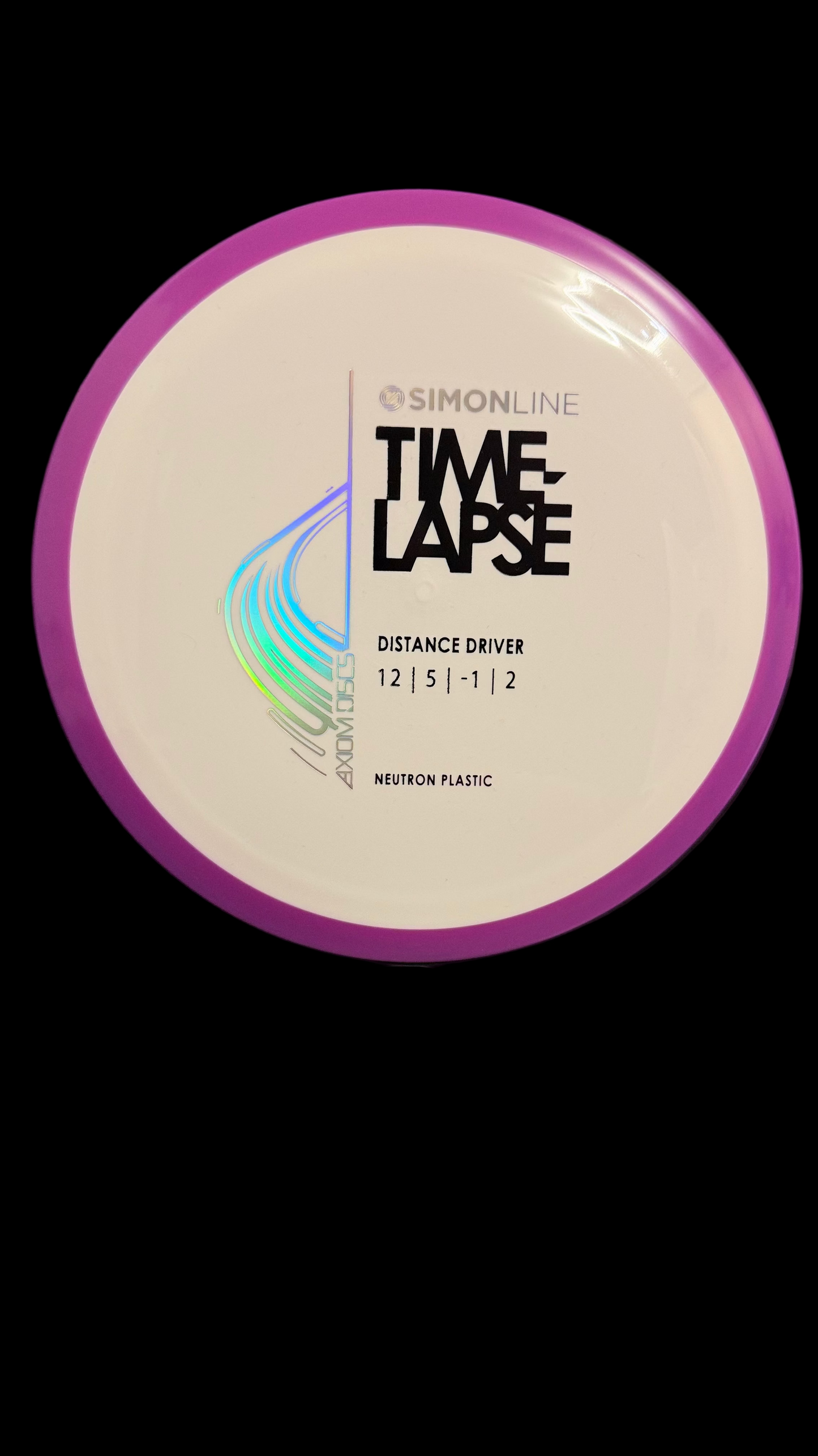 Axiom Neutron Time-Lapse distance driver in white with a purple rim, Simon Line stamp, flight numbers 12 | 5 | -1 | 2, displayed on a stand.