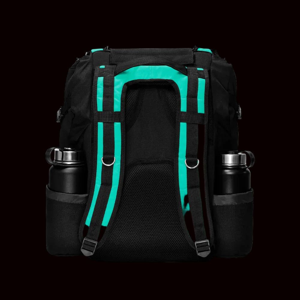 MVP Voyager Lite disc golf backpack in teal and black with front disc compartment holding teal discs, padded shoulder straps, and multiple storage pockets
