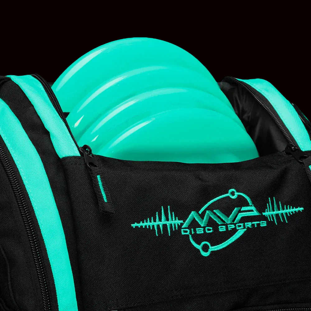MVP Voyager Lite disc golf backpack in teal and black with front disc compartment holding teal discs, padded shoulder straps, and multiple storage pockets